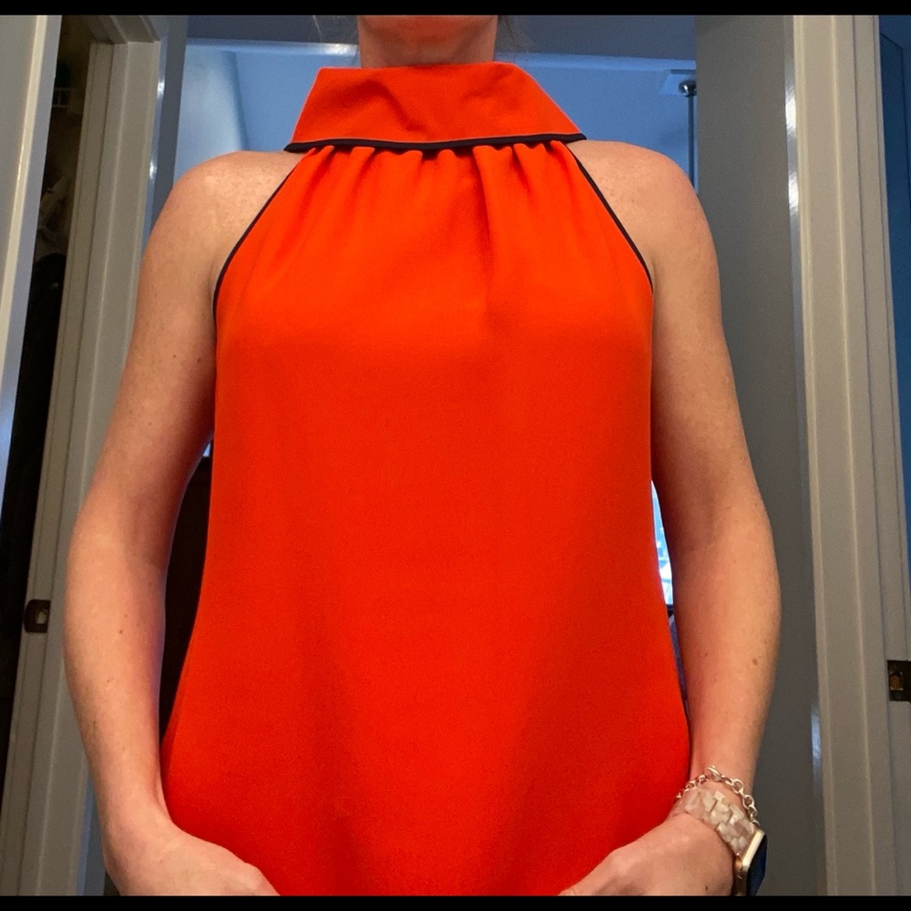 Red cowl neck sleeveless top w. Navy trim. Gold buttons on back